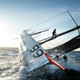 Illustration for article titled Spectacular stunt: Man runs up 98-foot ship mast and jumps into the sea